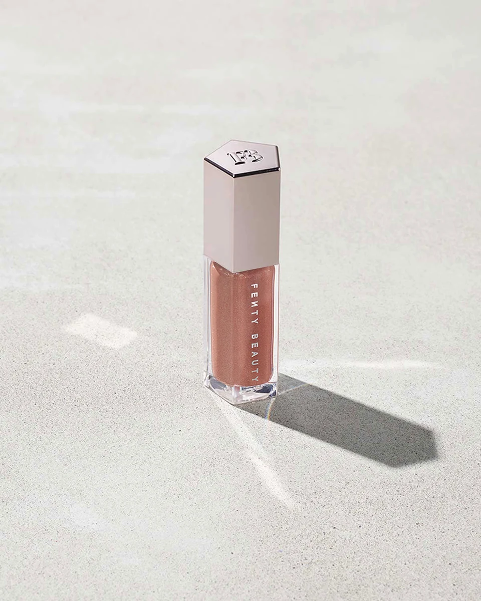 برق لب فنتی بیوتی مدل گلاس بمب یونیورسال Gloss Bomb Universal رنگ فنتی گلو Fenty Glow حجم ۹ میلی‌لیتر